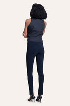Person wearing a navy blue outfit on a white background
